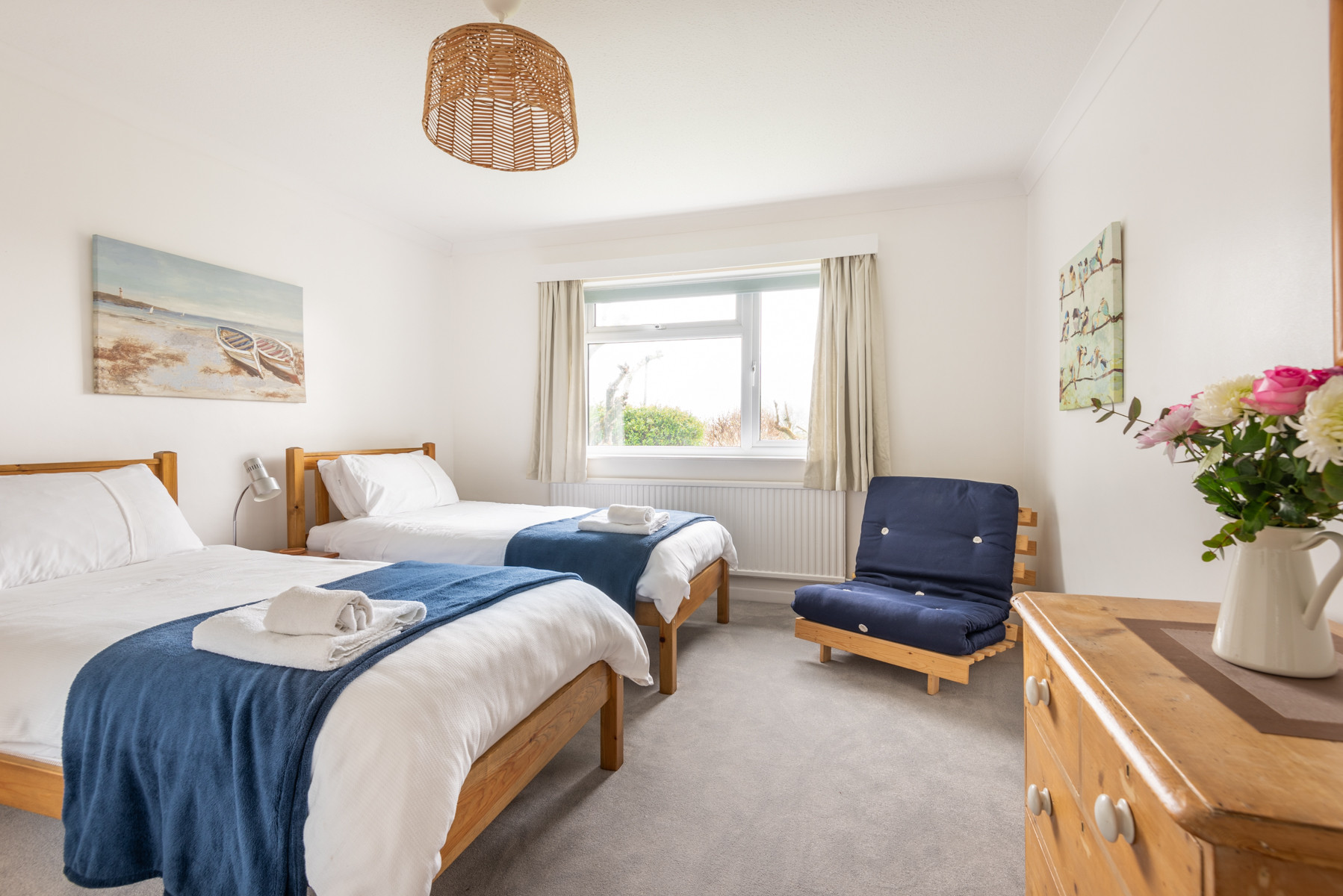 Bedroom 3 with twin beds and garden views