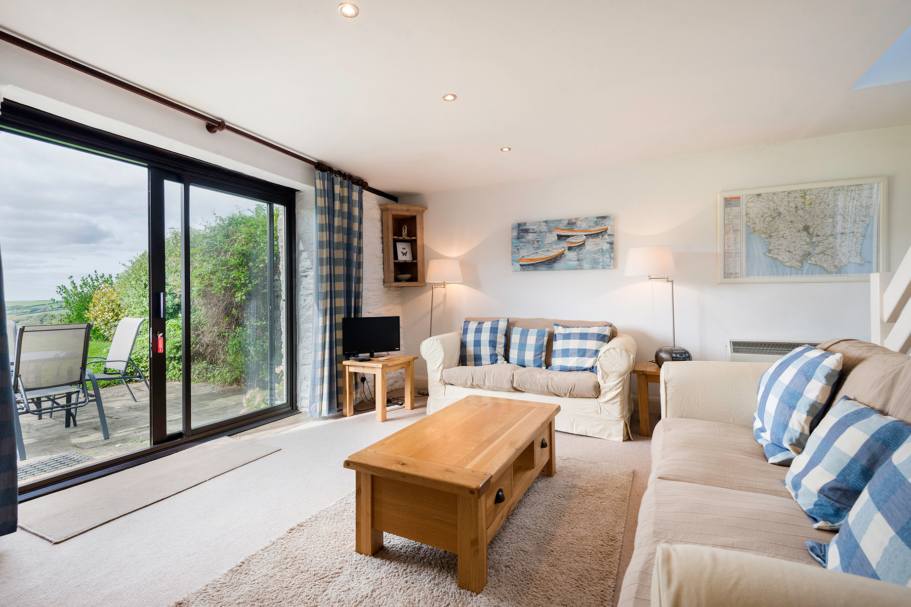 The sitting room with patio doors to the garden