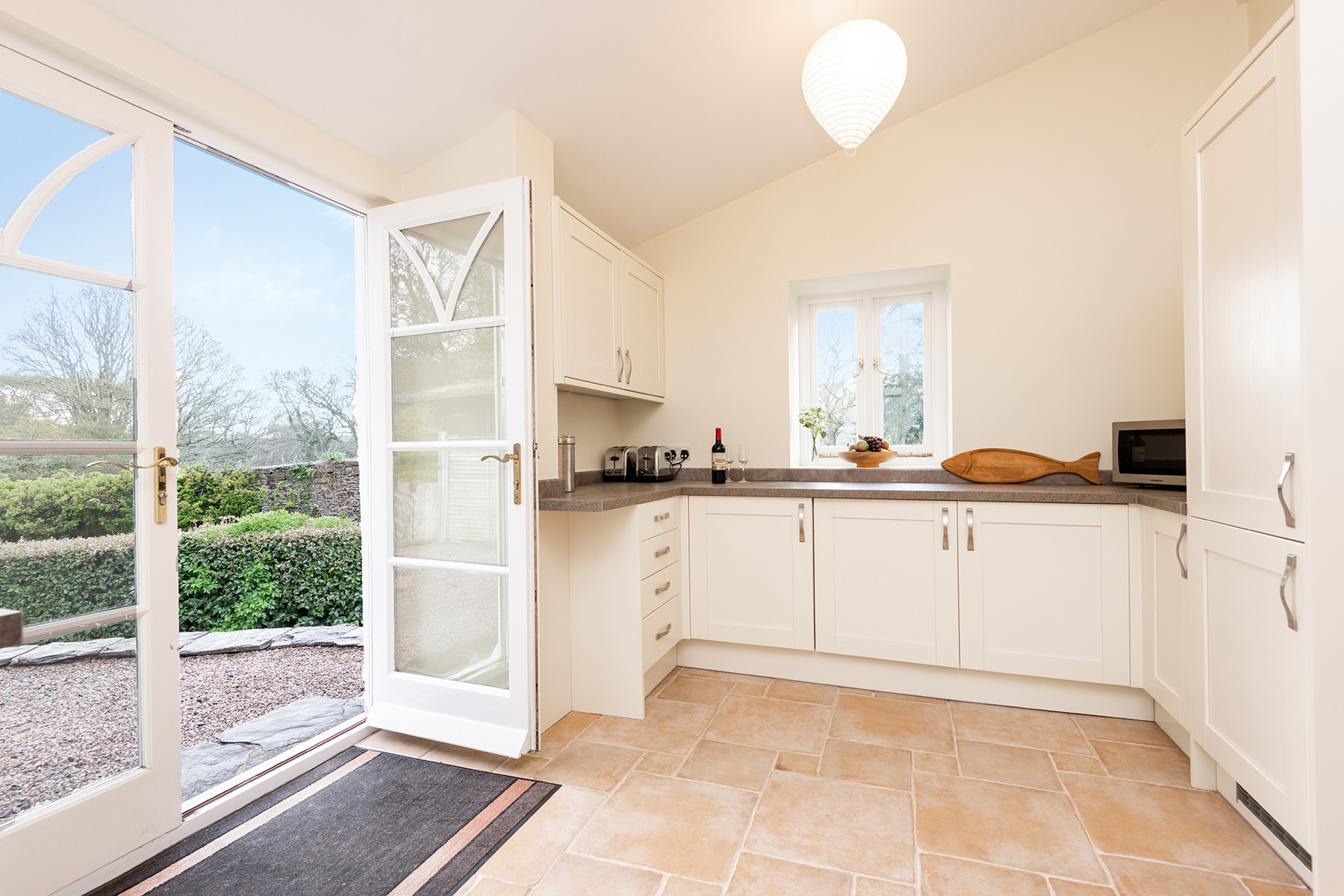 Patio doors lead to outside. 