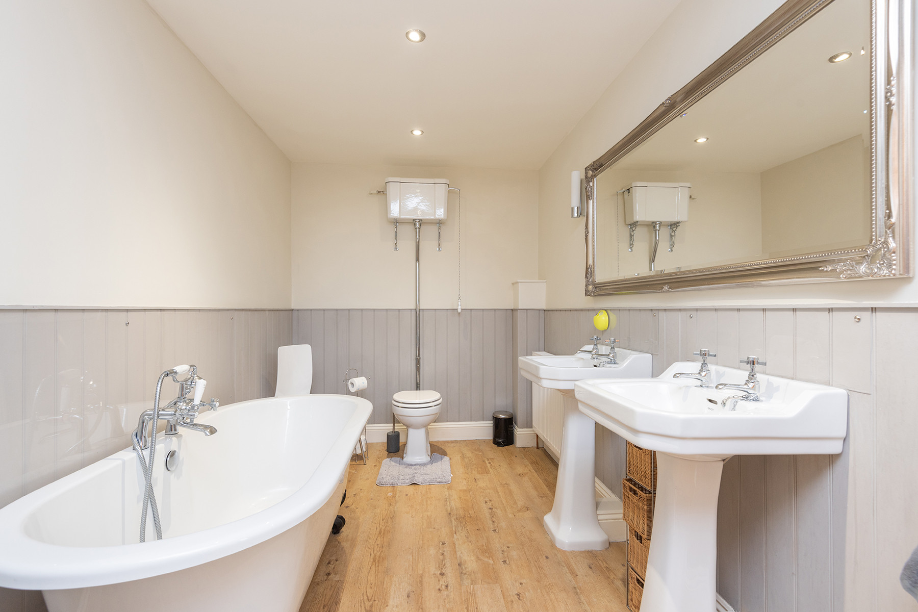 Family bathroom with rolltop bath and separate shower 