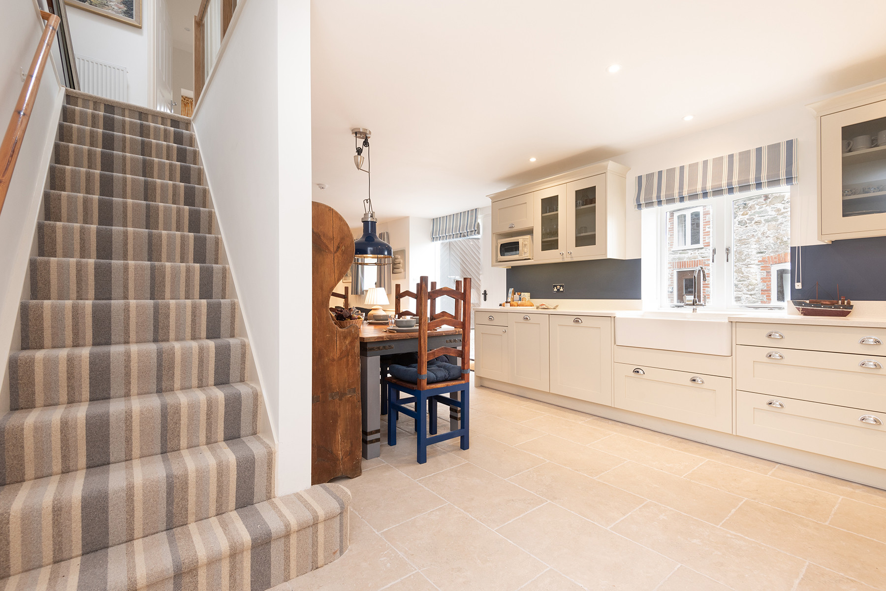 Stairs lead from the kitchen to the first floor.