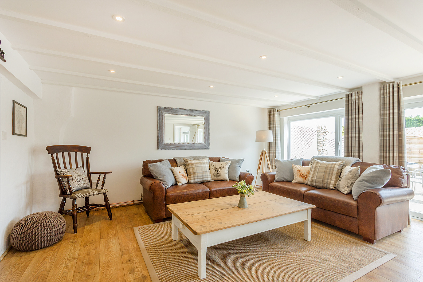 Sofas and wooden armchair in the seating area