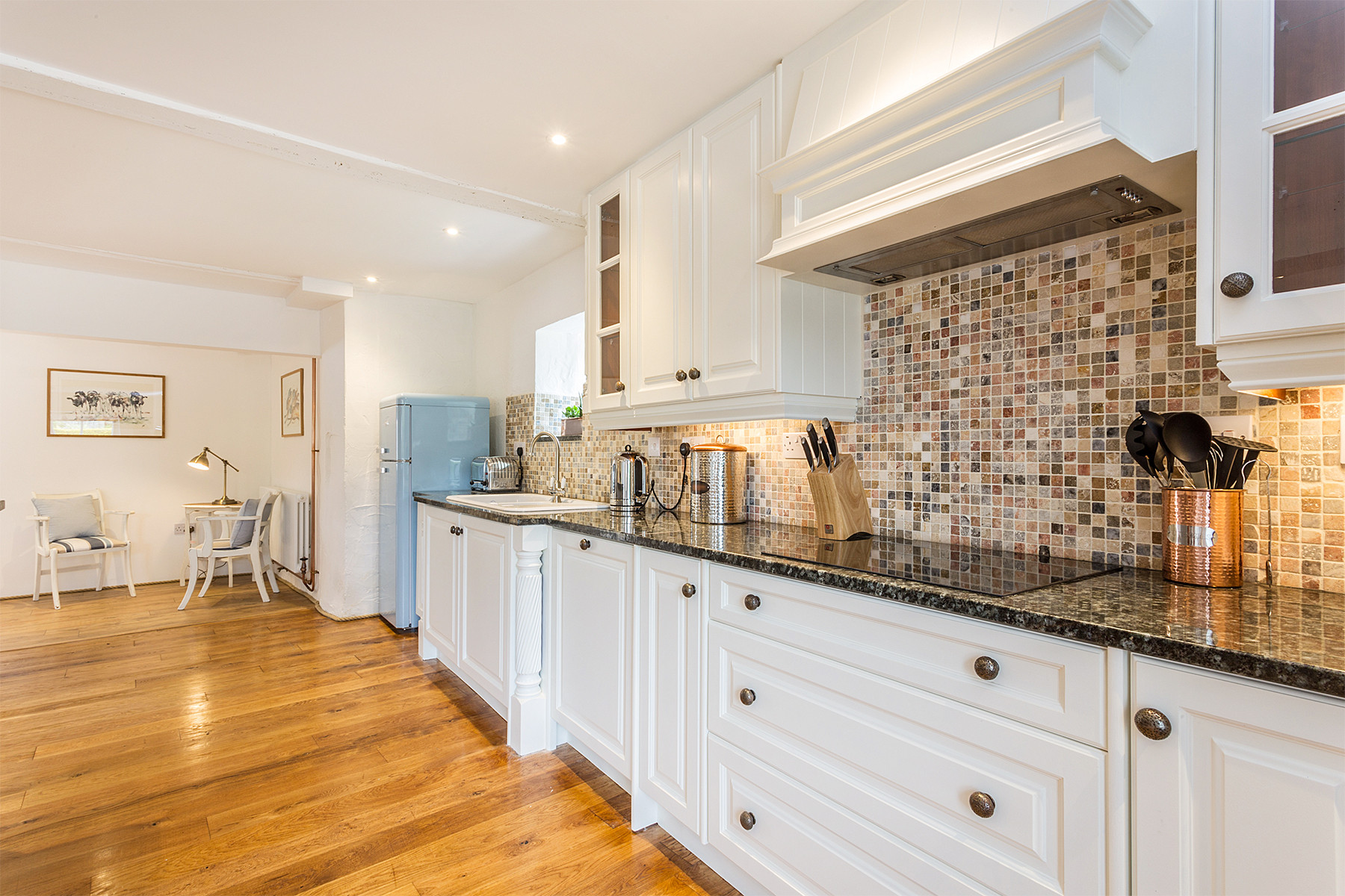 Kitchen work surfaces, sink and cooking area