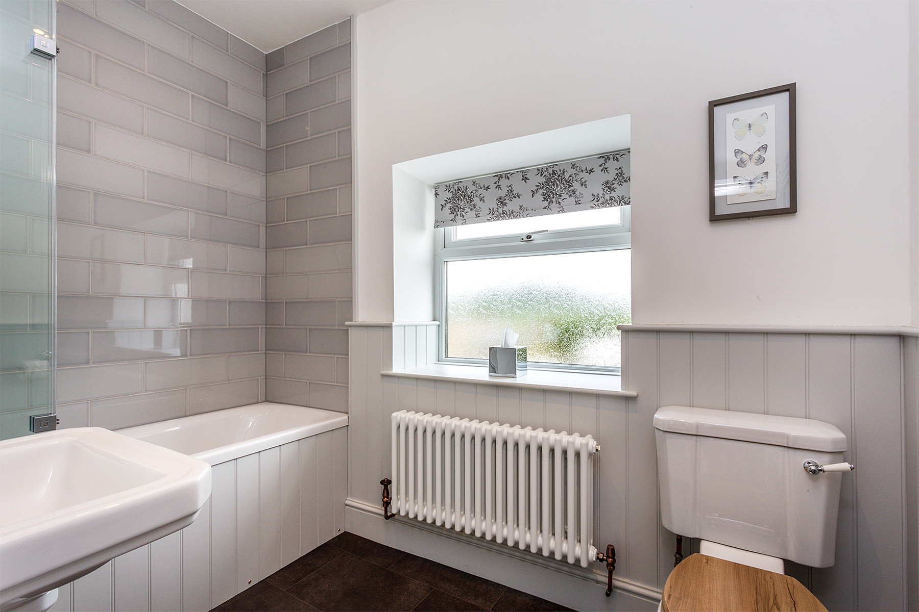 Family bathroom with shower over the bath 