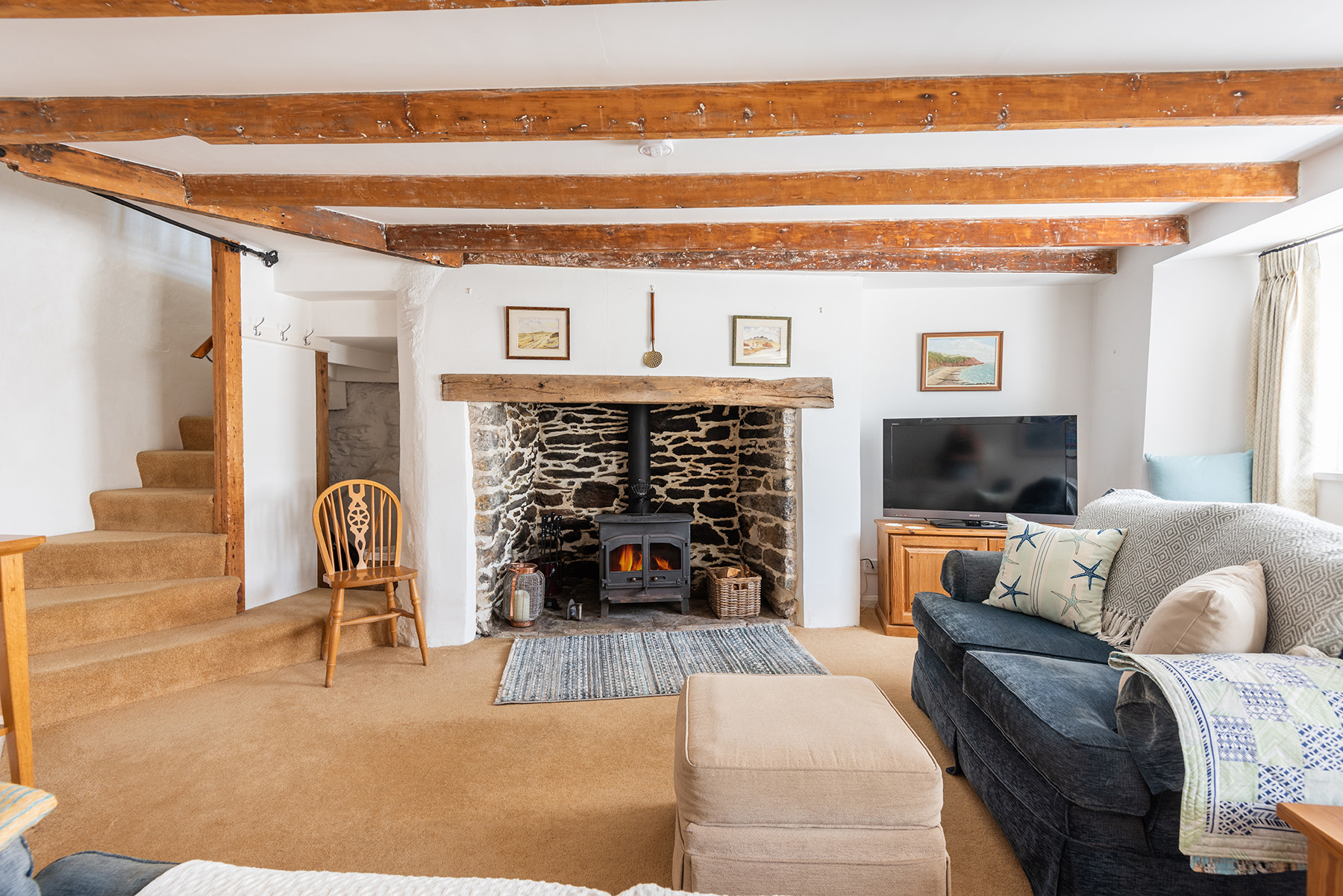 The spacious yet cosy lounge-perfect for relaxing by the log burner on a cool winters evening