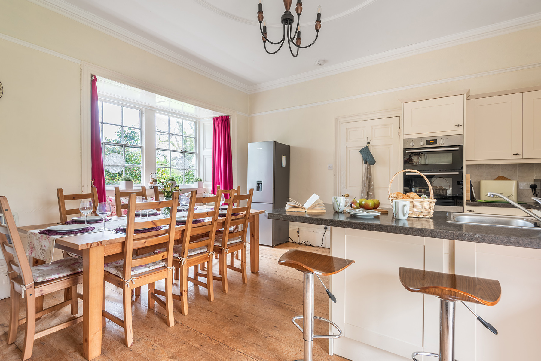 The bright, airy kitchen with plenty of space to dine