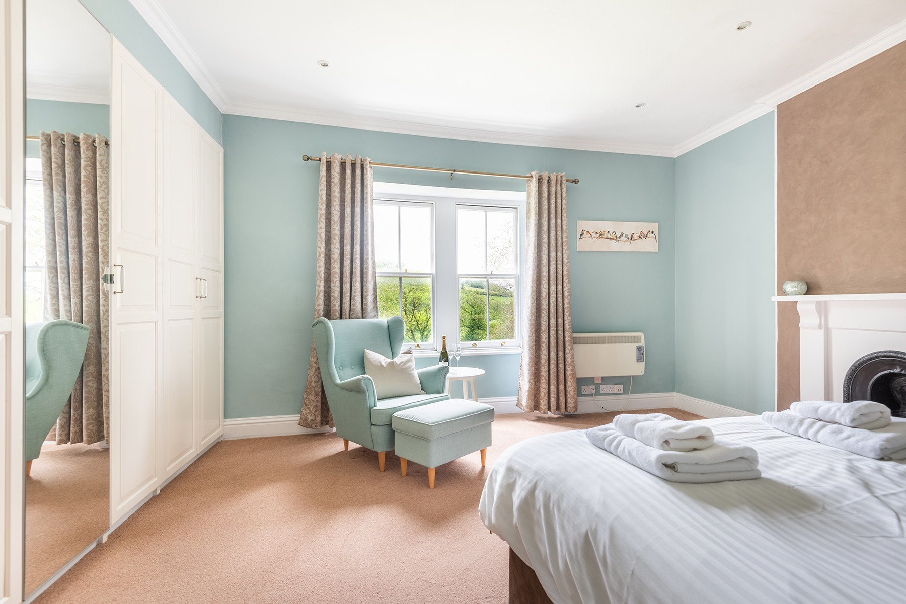 The main bedroom overlooking farmland at the rear of this lovely three bedroom wing of a beautiful period home a short distance from Kingsbridge estuary