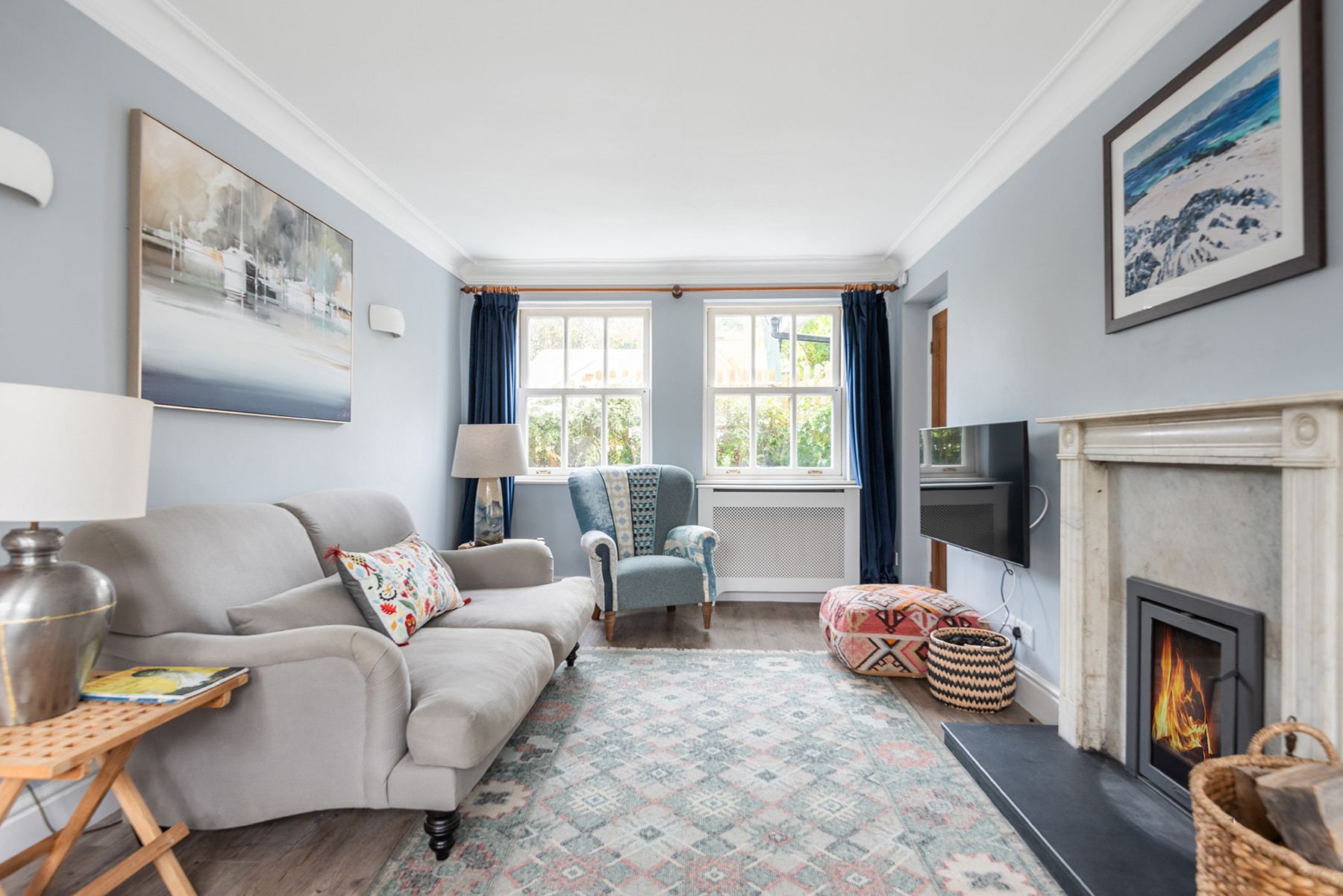 Another look at the sitting room, complete with log burner