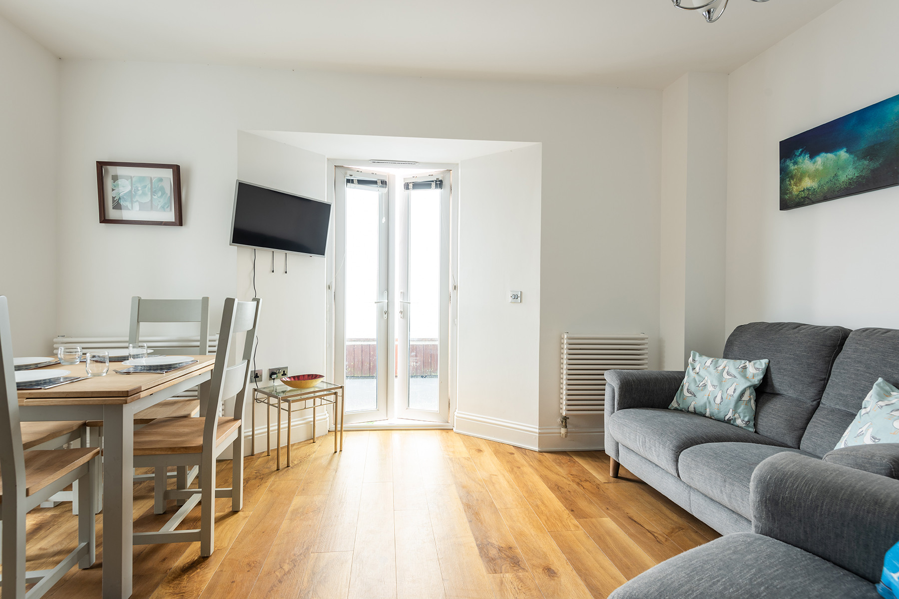 Cosy up on a winters day or relax in the cool and let the sea breeze whisper through the doors