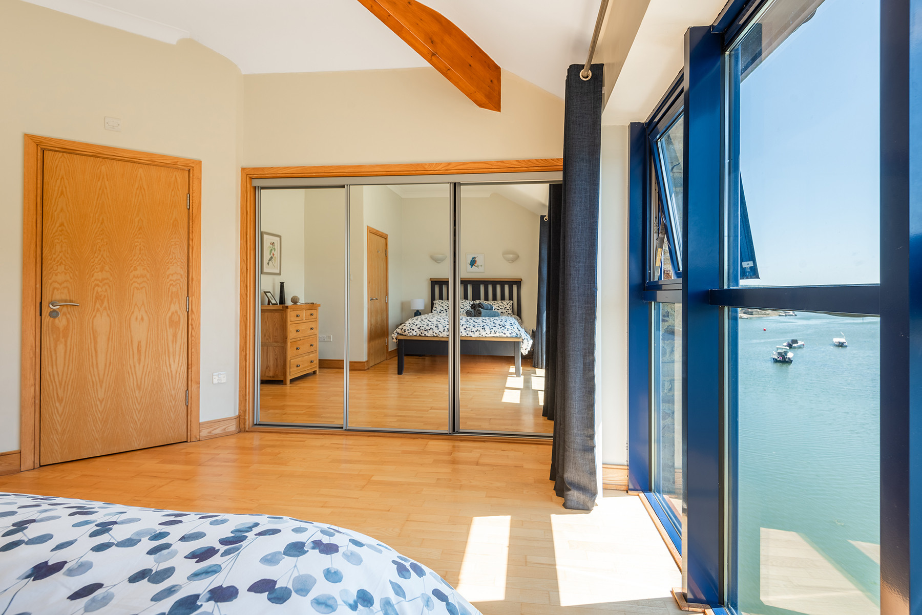 Another view of the master bedroom, what a view to wake up to and enjoy through full height windows! 