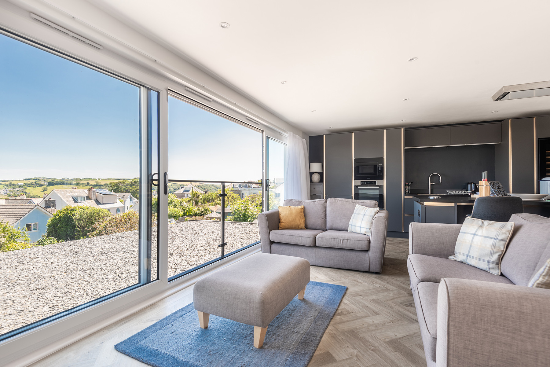 Open plan sitting room with estuary views