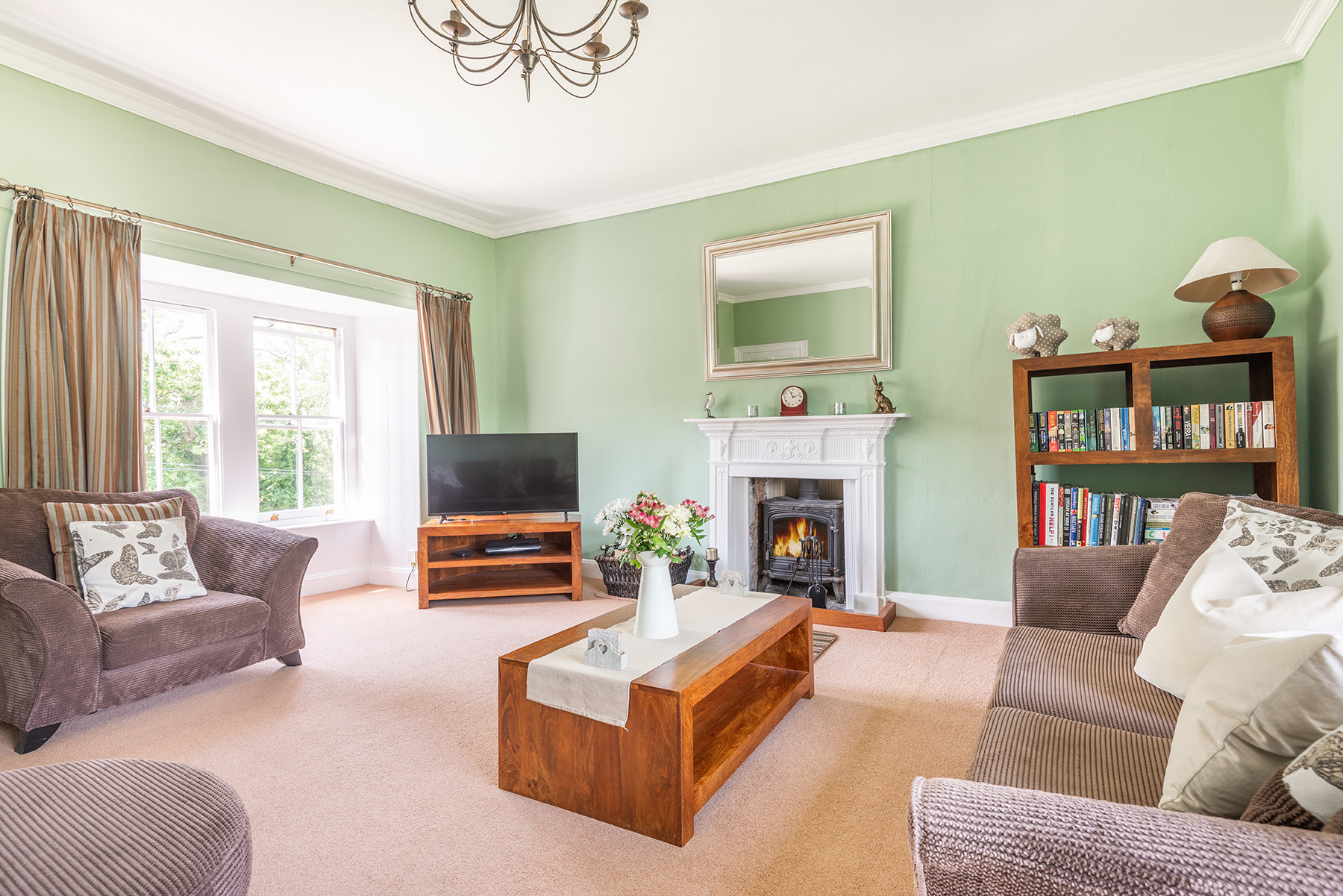 Another view of the lounge with log burner