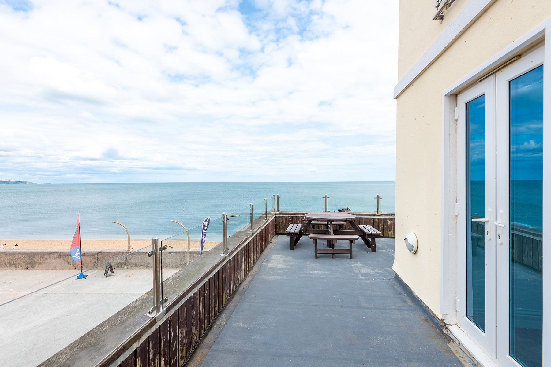 The balcony has views over the beach and village
