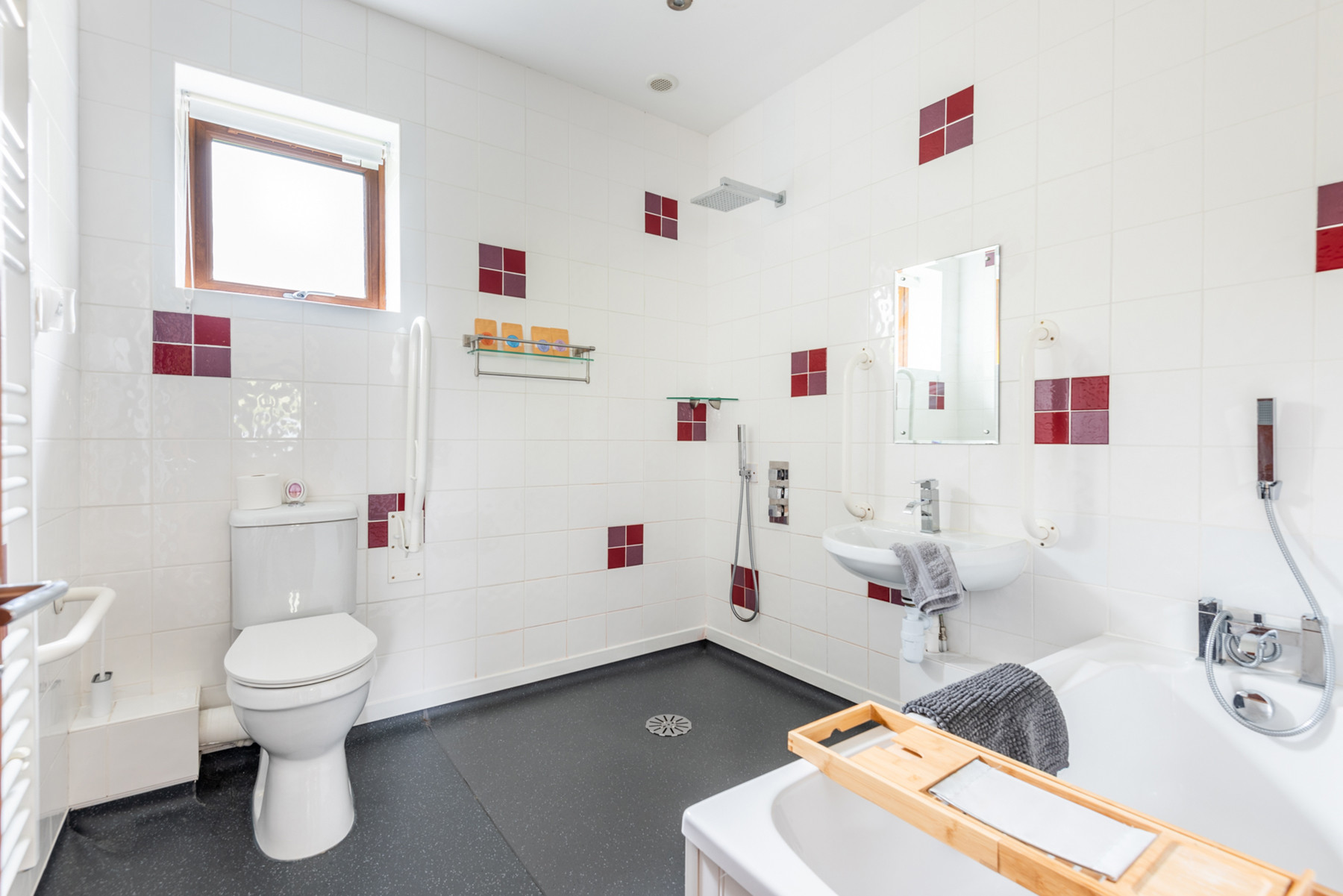 The wetroom, complete with various grab rails, shower seat and all wheelchair accessible).