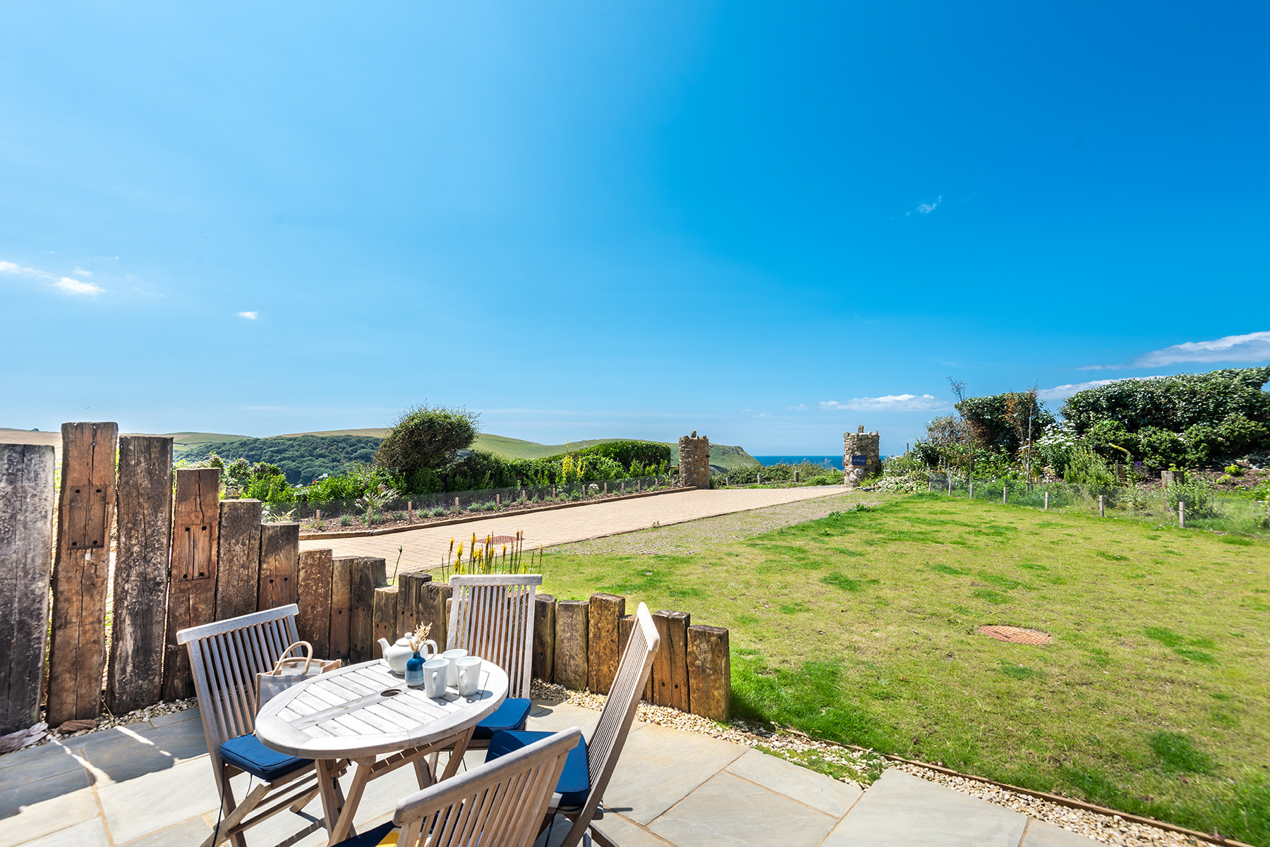 The rear terrace with outside seating and sea views