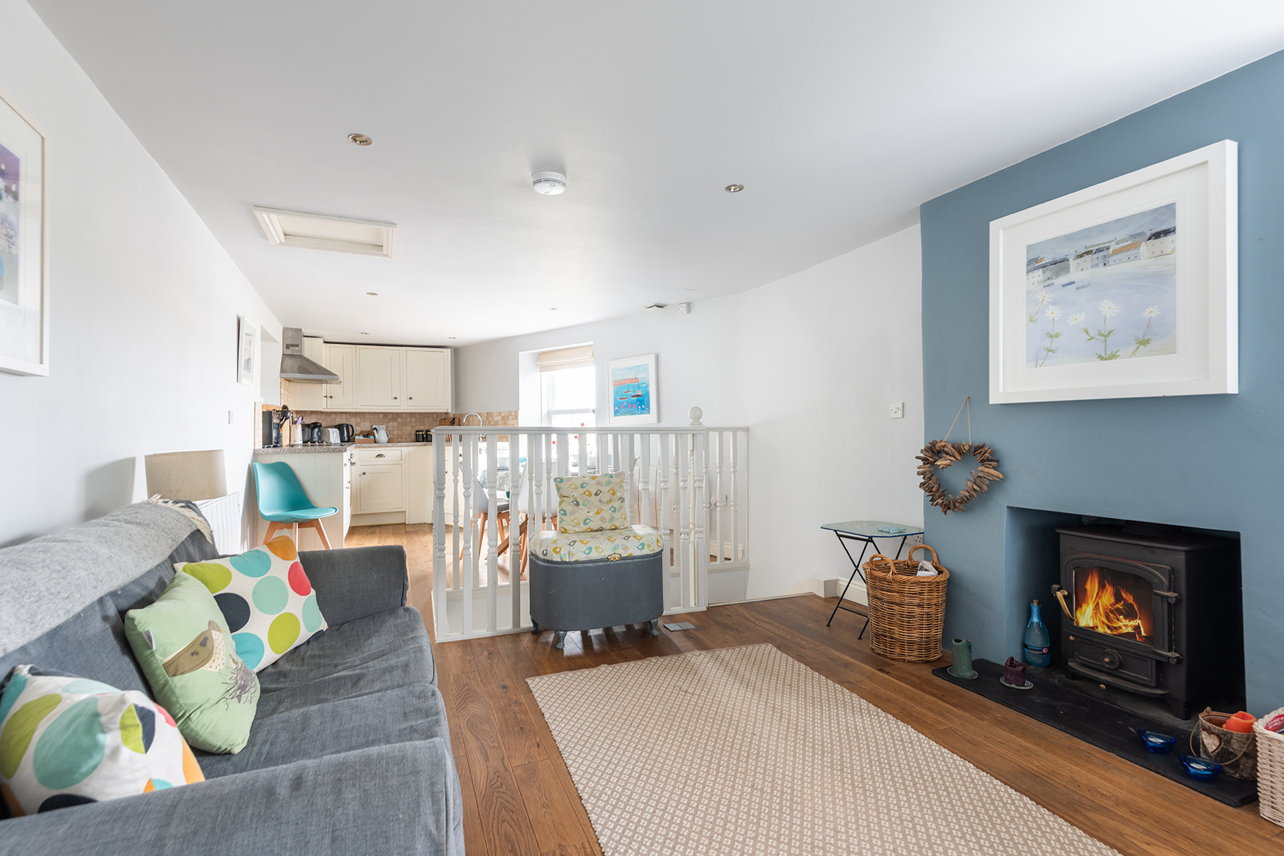 Open plan living space with cosy woodburner