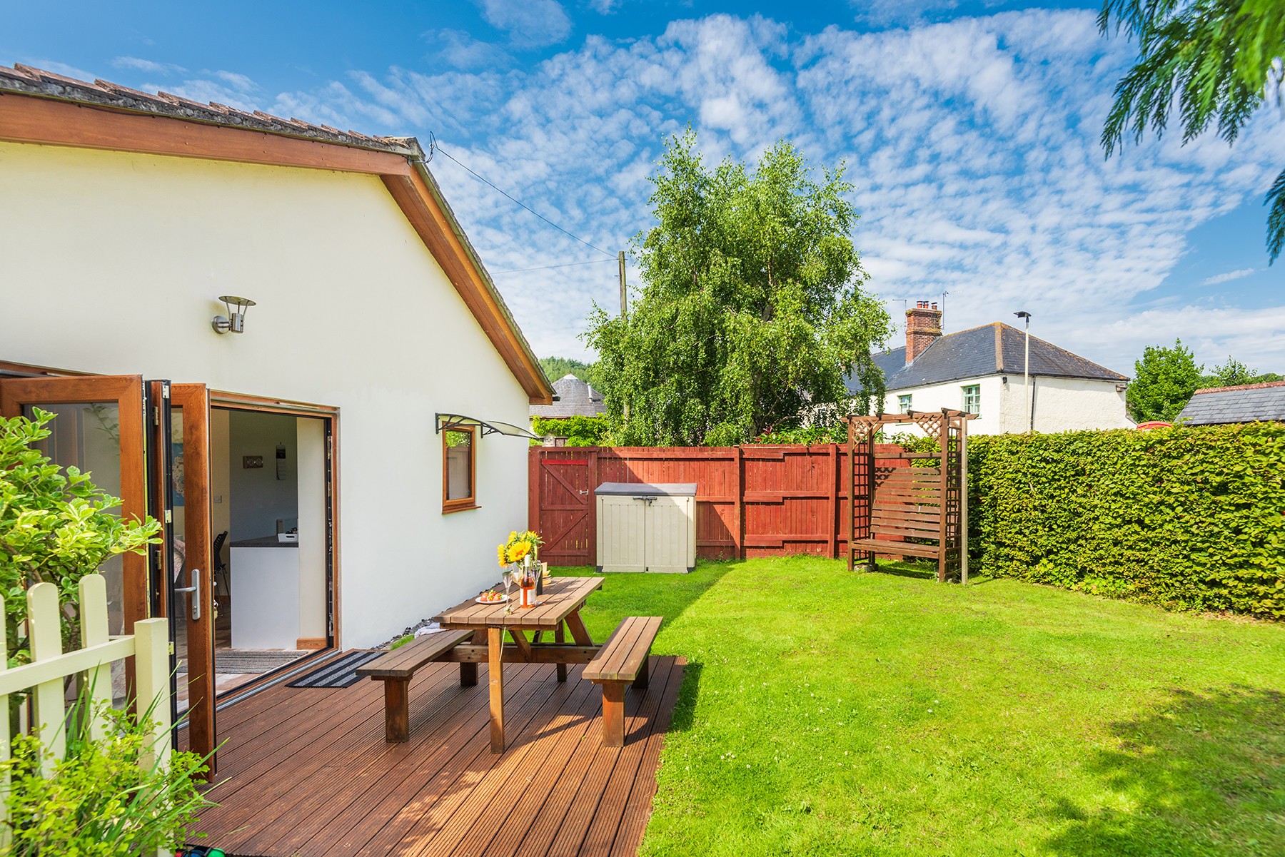 Another view of the garden, showing the patio doors from the lounge.