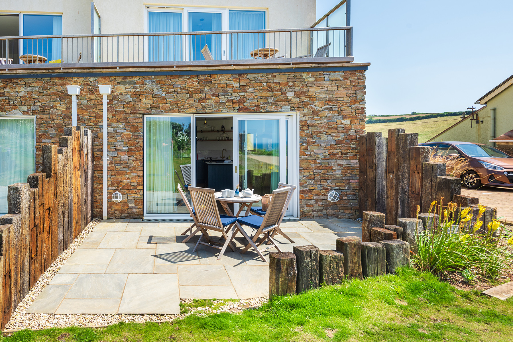 The lovely patio area, overlooking the communal garden and sea. 