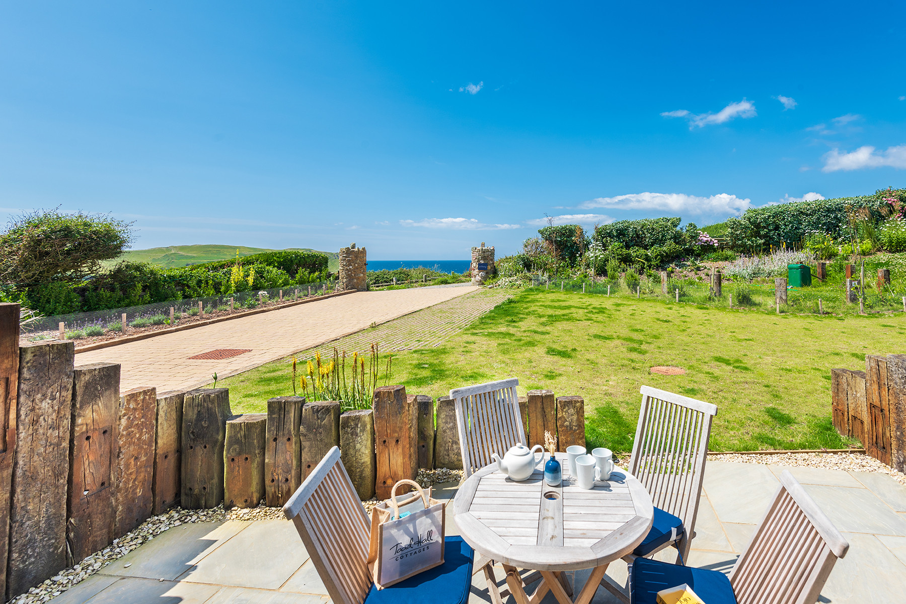 Number 1 enjoys a lovely private terrace, overlooking the communal garden area towards the sea. 