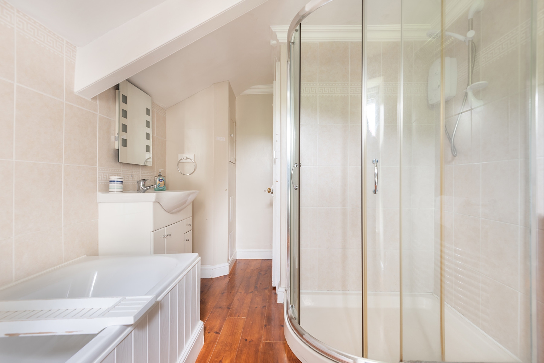 The family bathroom with shower enclosure