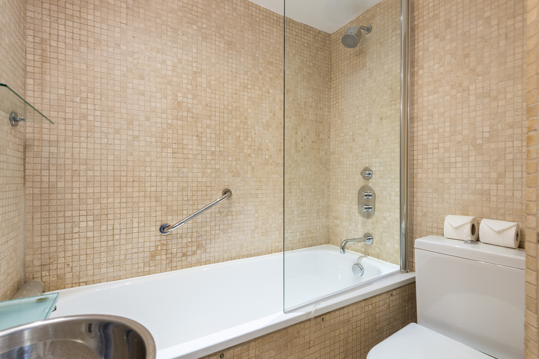 First floor family bathroom with bath and shower over