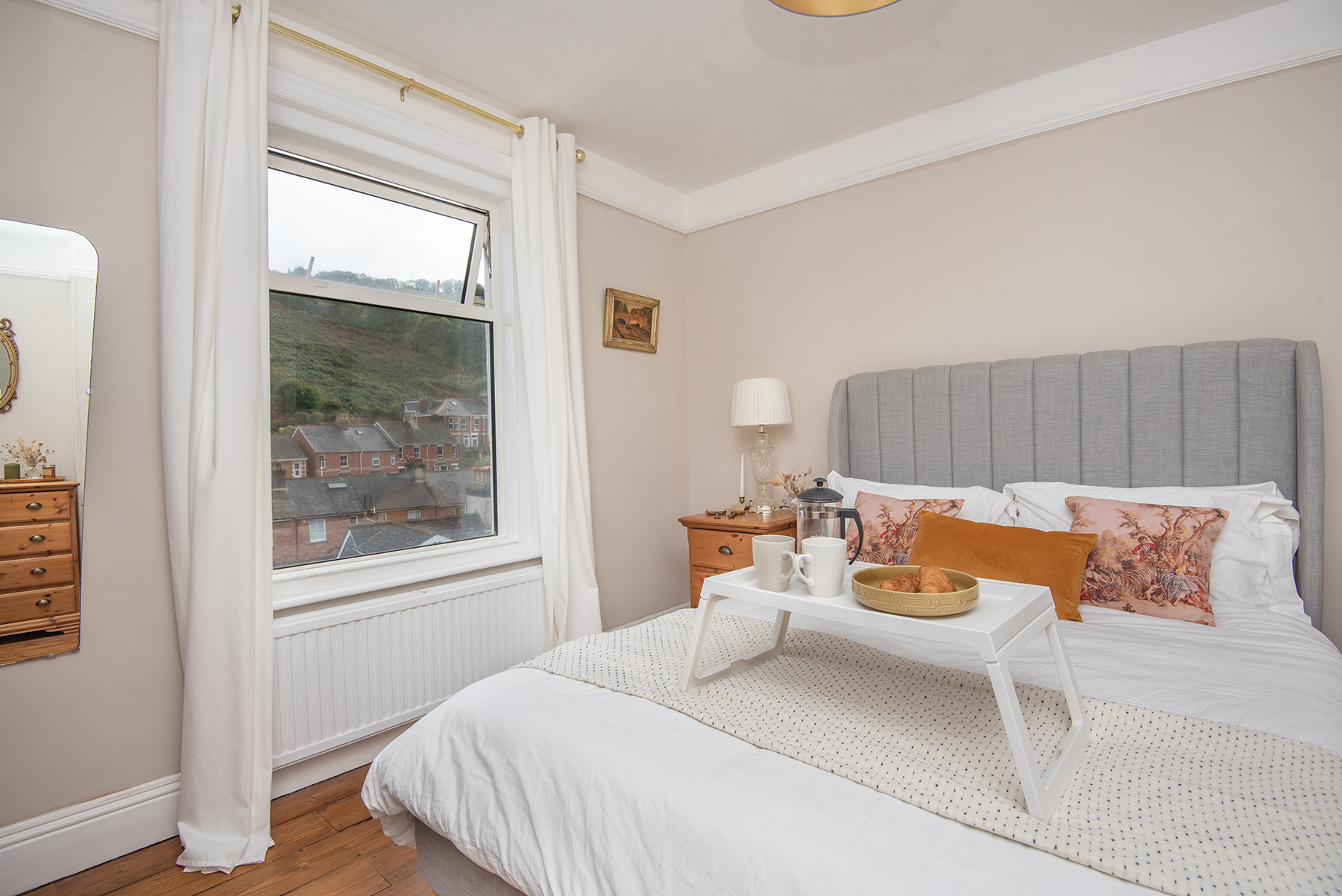 Master bedroom with views across local fields and down the valley to town
