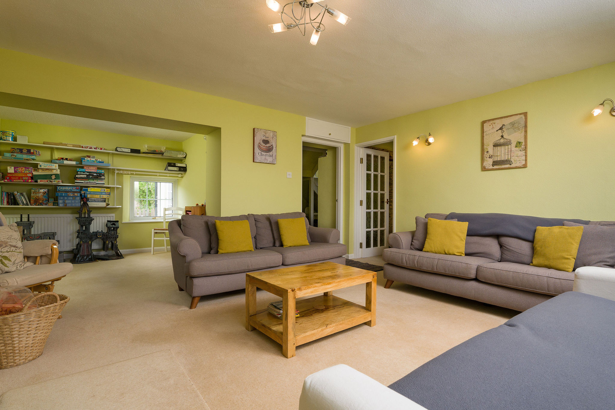 The living room has a cosy logburner