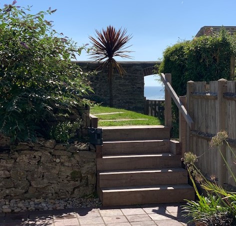 Steps leading up to raised deck with views