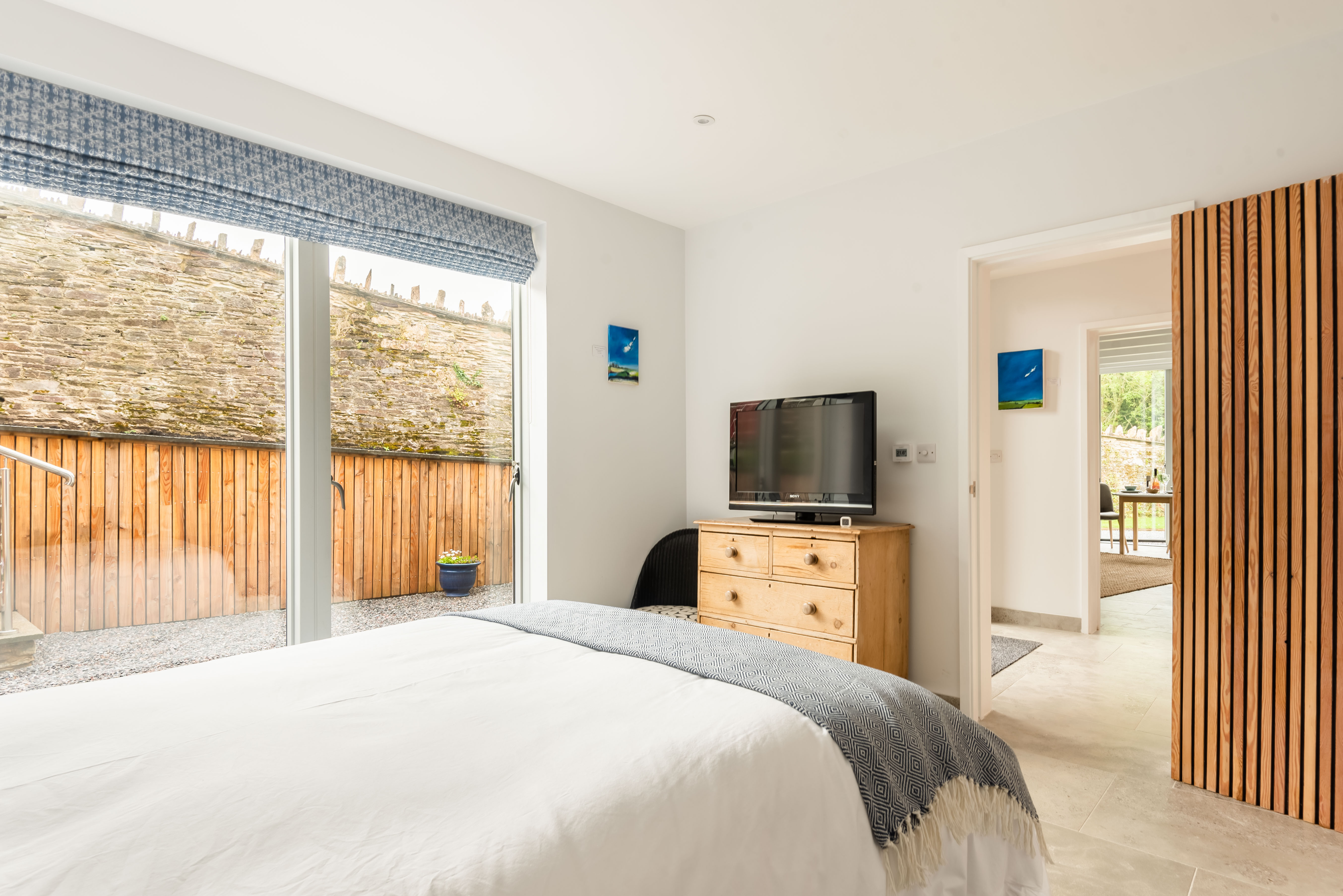 Bedroom looking out through to the living area