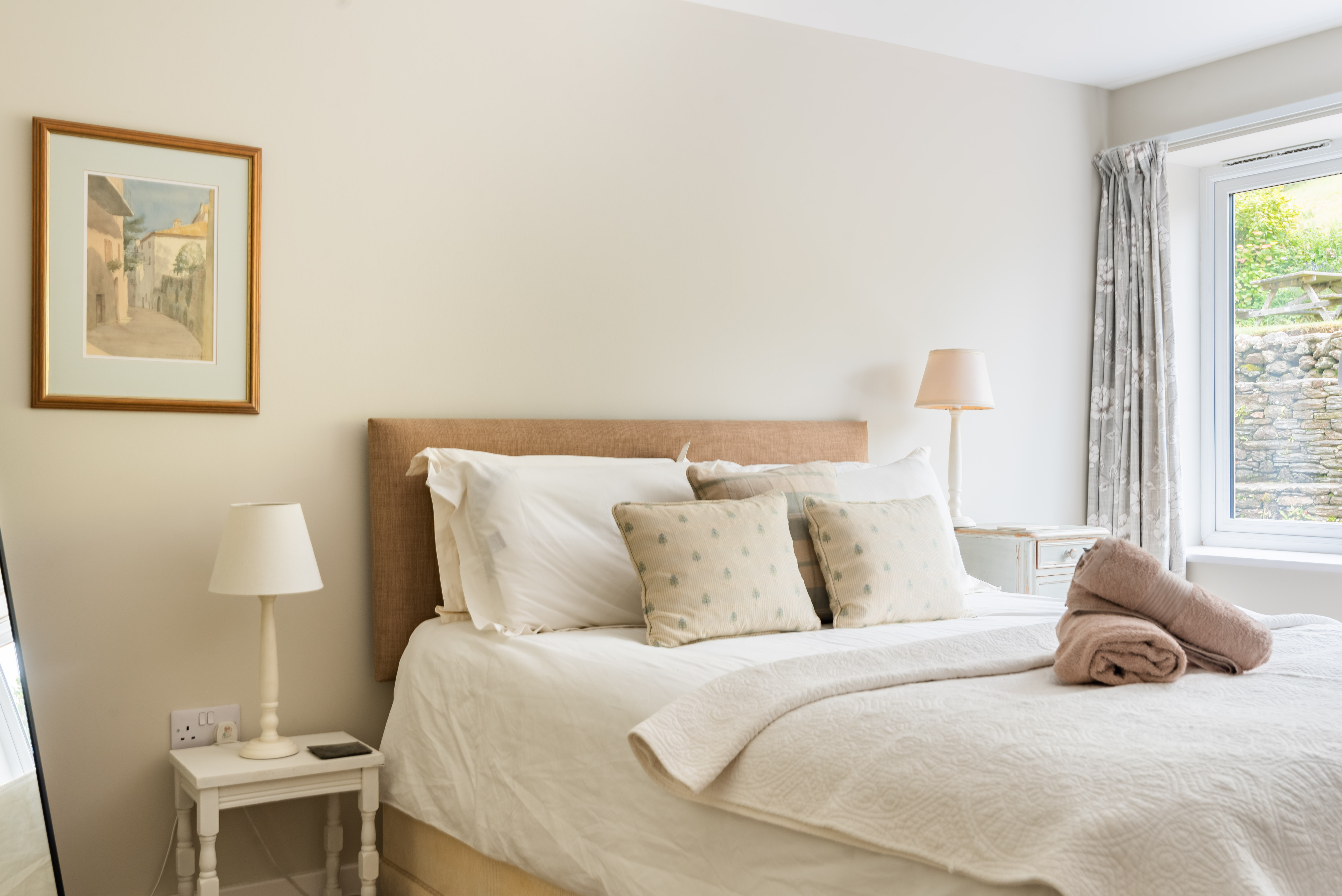 Bedroom 1 on the ground floor with views over the garden and field behind