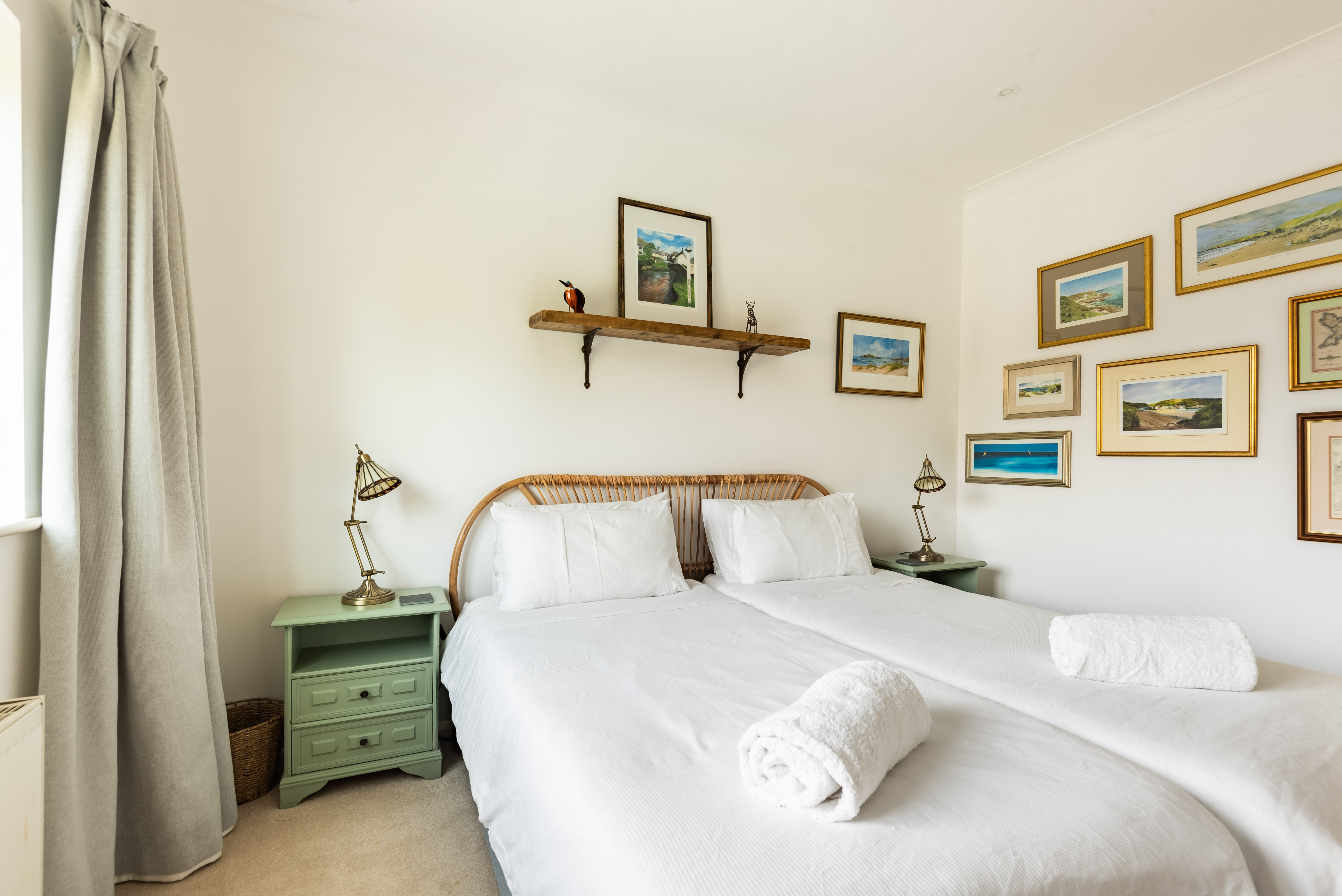 Stylish bedroom 2 with twin 3' beds and rear garden views