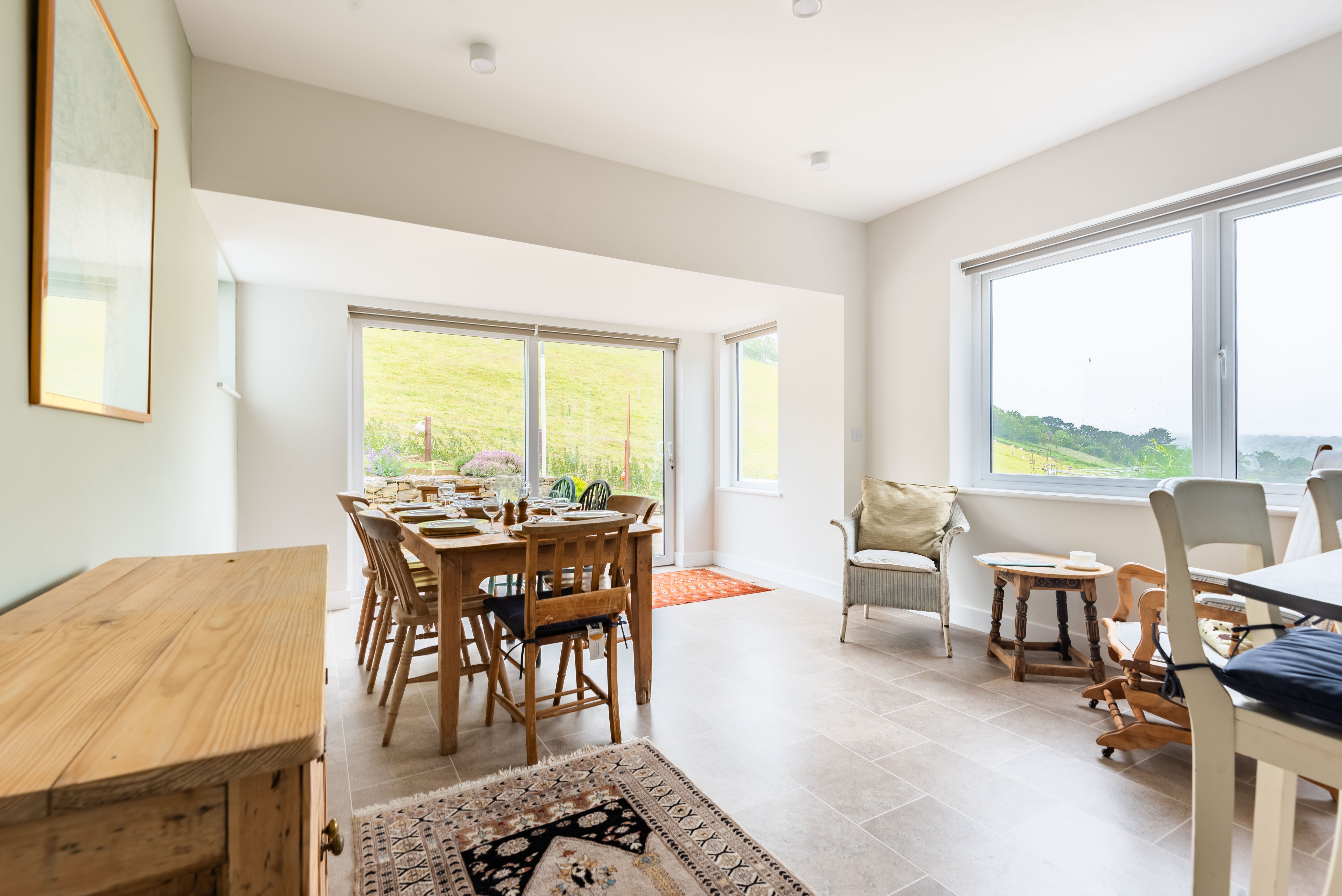 The dining space with occasional chairs to relax and enjoy a cup of coffee