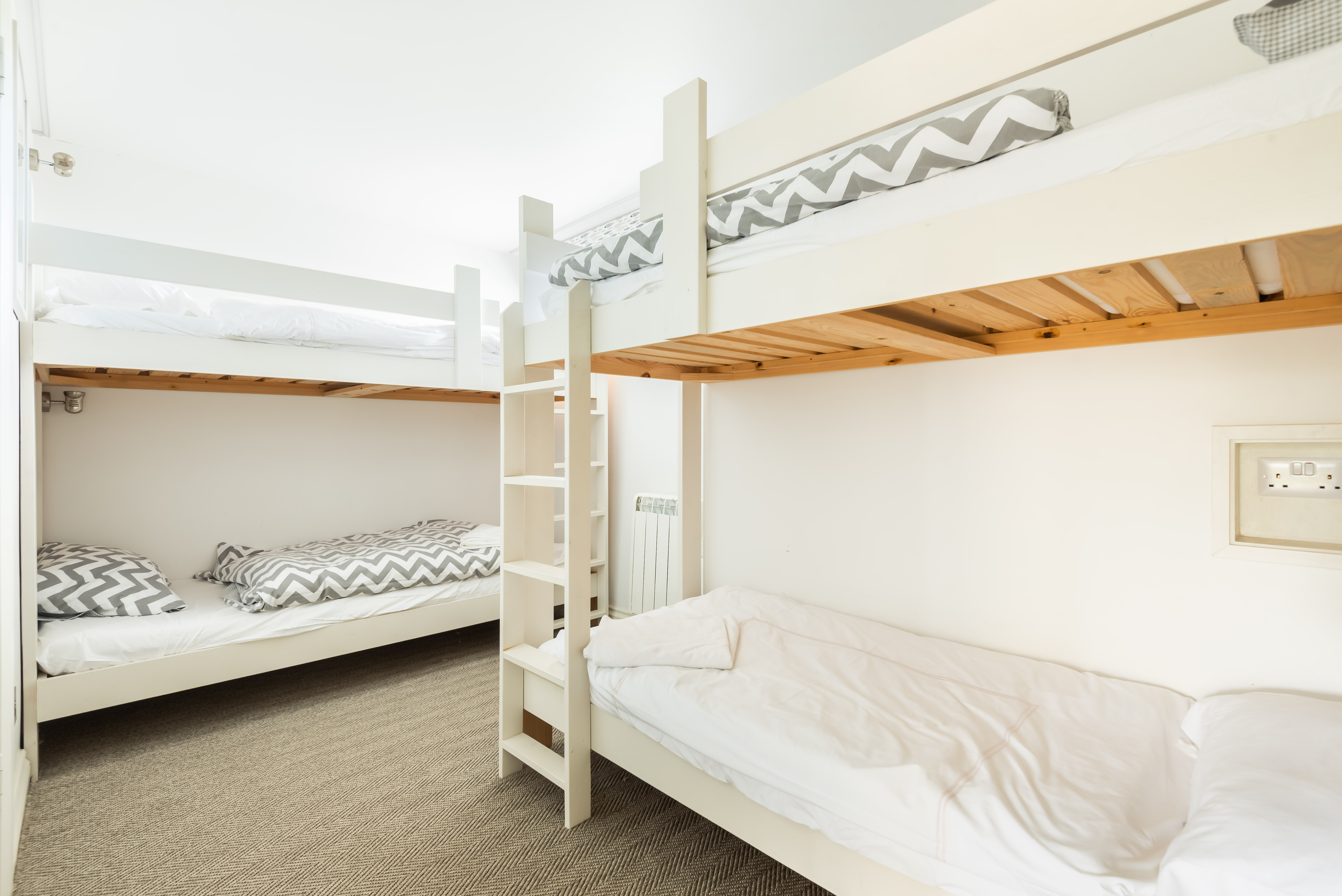 The dorm room with two sets of bunk beds