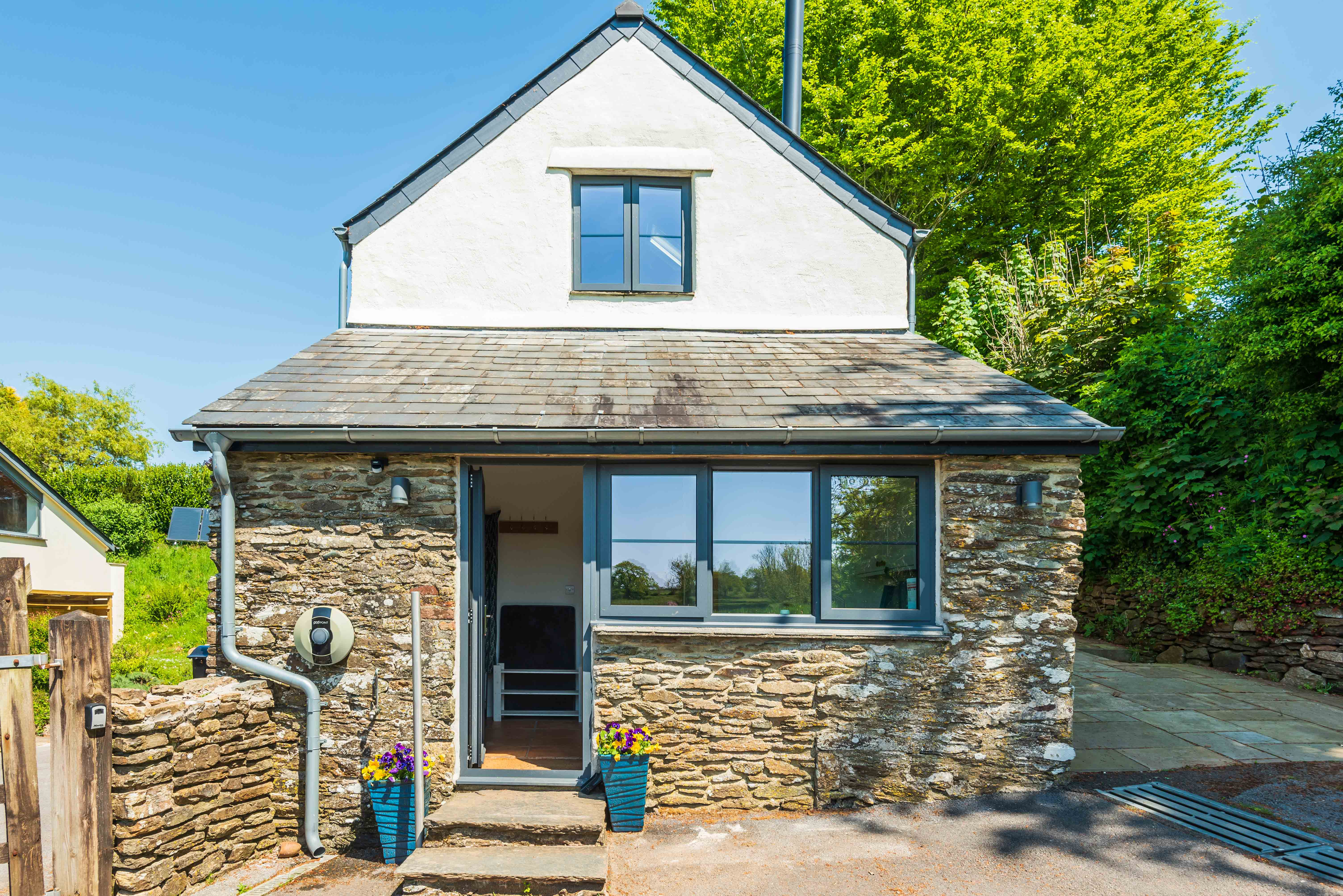 Side view of the property, door into the utility 