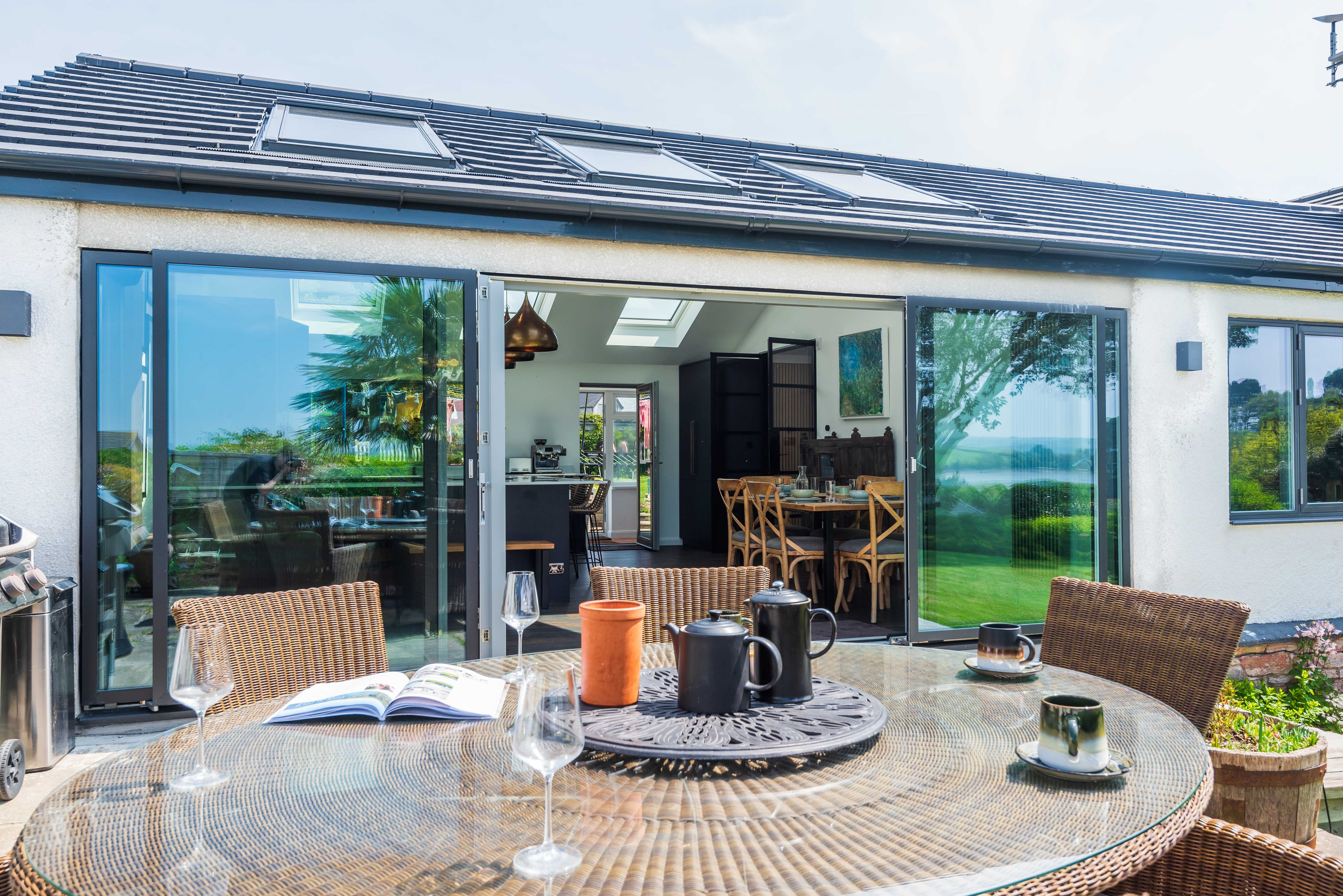 The stunning kitchen diner opens out on to the terrace with outdoor table, barbecue and hot tub.