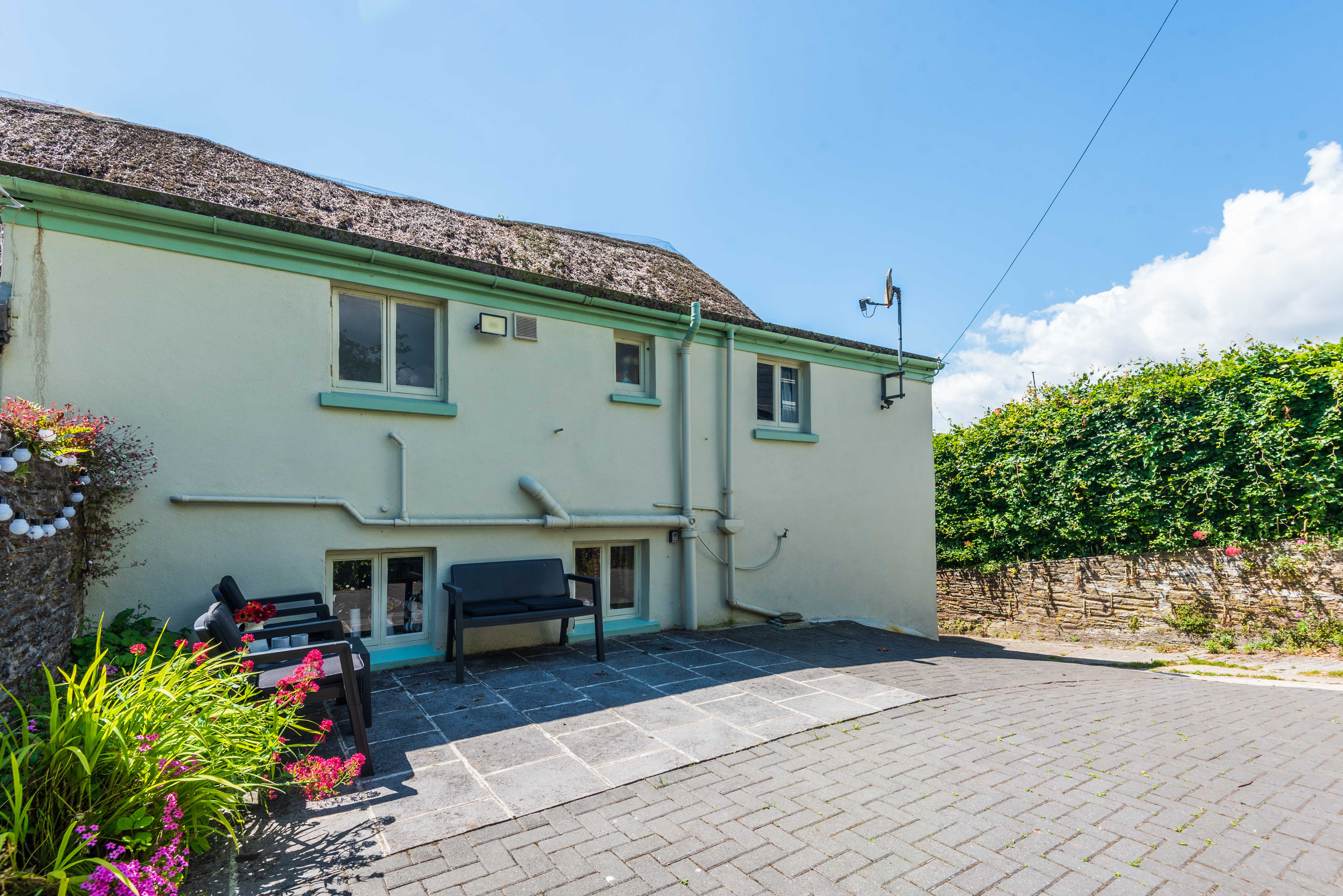 The rear of the cottage with terrace in view