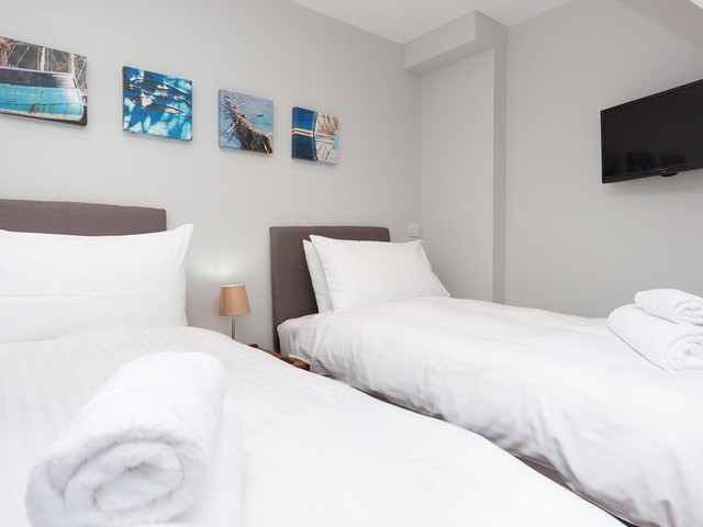 Bedroom 2 with twin 2.6ft beds and Smart TV