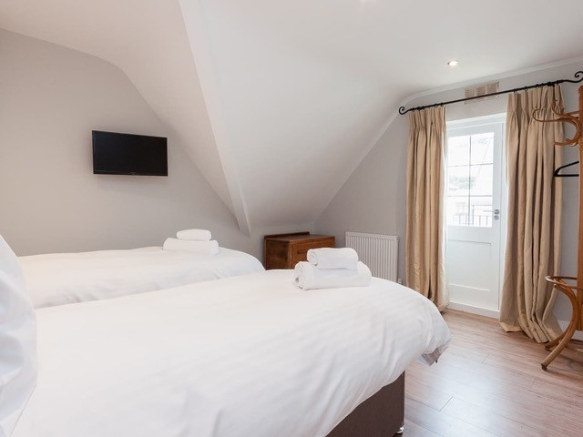 Bedroom 2 with door leading to balcony
