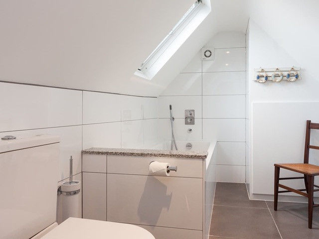 Bedroom 3 ensuite with bath and handheld shower
