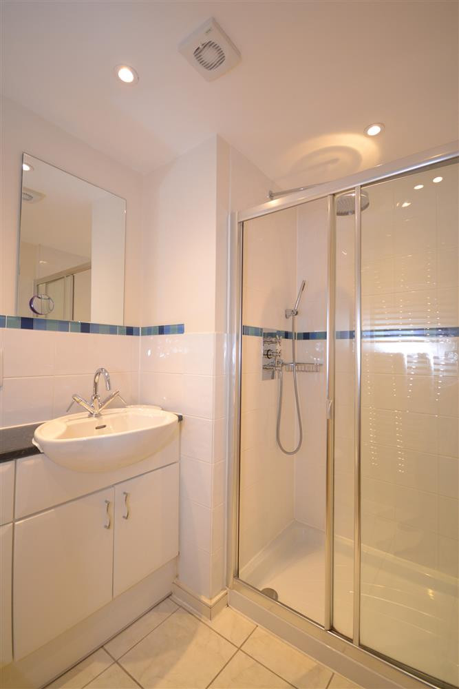 The en suite shower room to the double bedroom